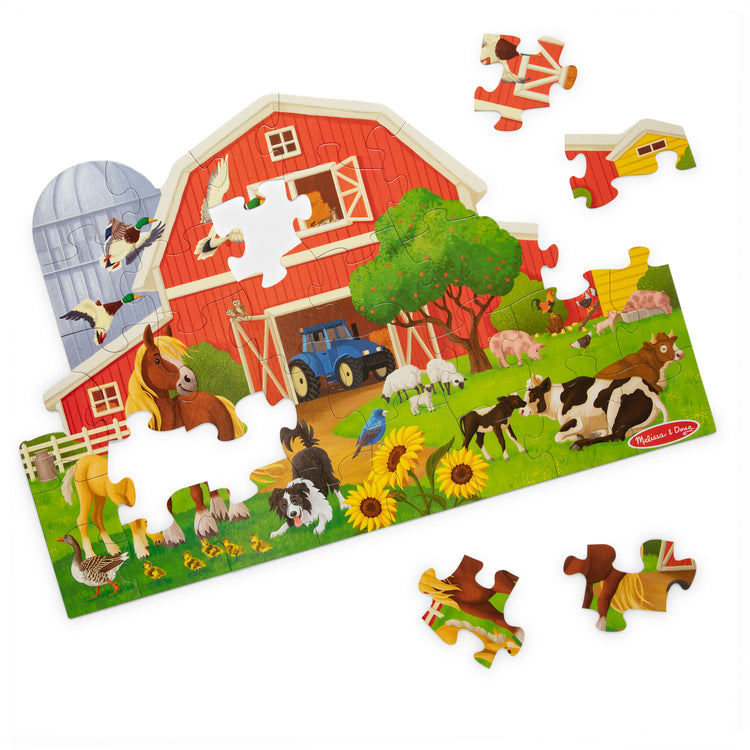 The loose pieces of The Melissa & Doug Busy Barn Shaped Jumbo Floor Puzzle, 32-Piece Barn-Shaped Jigsaw Puzzle with Farm Animals, 3 x 2 Foot Toddler Puzzles for Kids Ages 3+