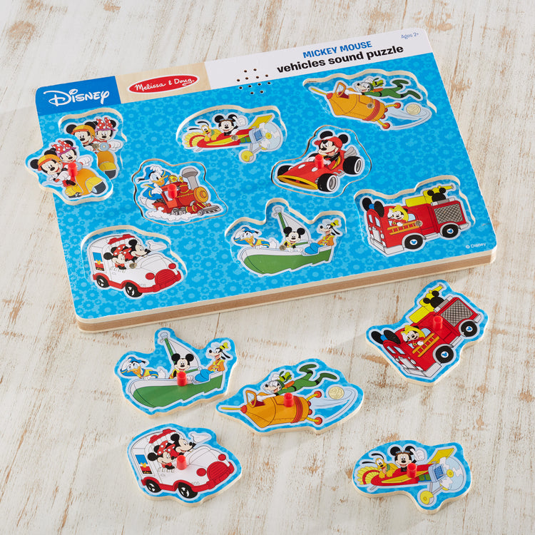 A playroom scene with The Melissa & Doug Disney Mickey Mouse and Friends Vehicles Sound Puzzle (8 pcs)