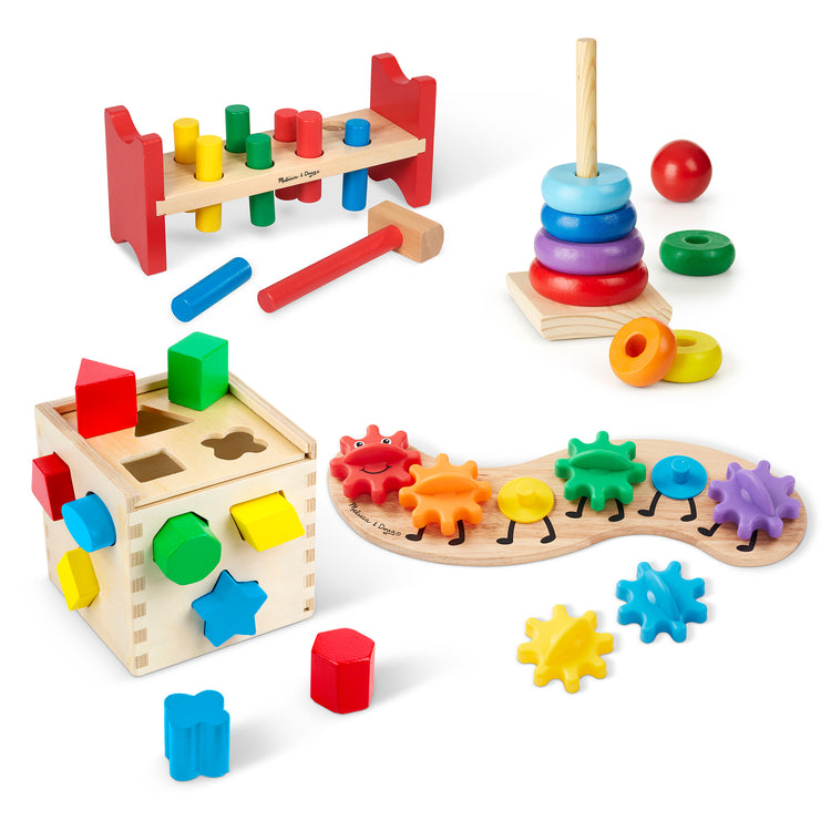 The loose pieces of The Melissa & Doug 4 Wooden Classic Rainbow Learning Toys