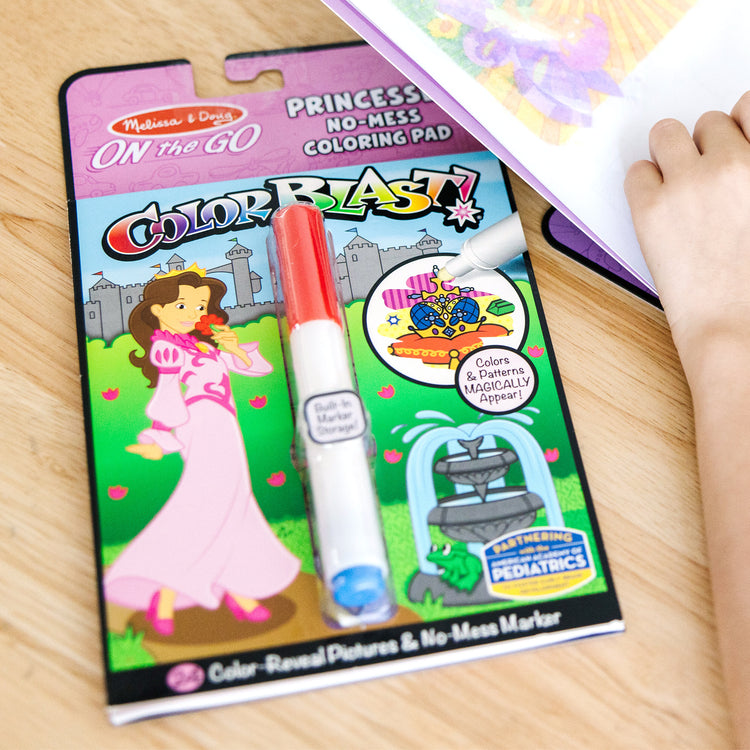 A kid playing with The Melissa & Doug On the Go ColorBlast! Activity Book - Princess (24 Pages)