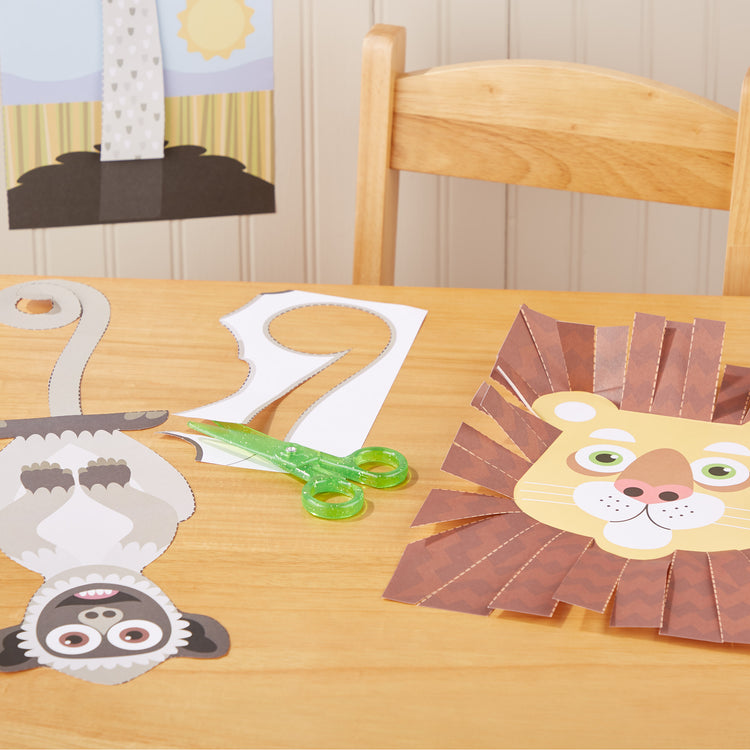 A playroom scene with The Melissa & Doug Safari Scissor Skills Activity Pad with Child-Safe Scissors – 20 Pages