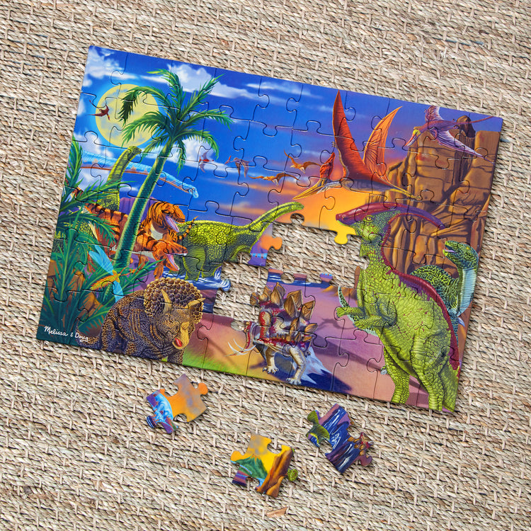 A playroom scene with The Melissa & Doug Land of Dinosaurs Jigsaw Puzzle (60 pcs)