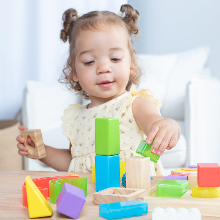 A kid playing with The Sensory Matching Blocks