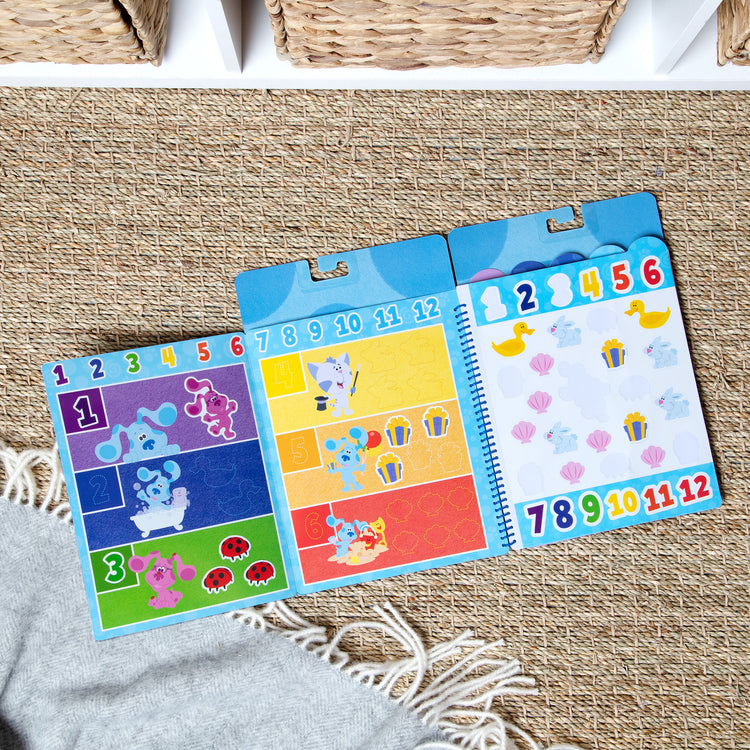 A playroom scene with The Melissa & Doug Blue’s Clues & You! Restickable Stickers - Numbers & Letters