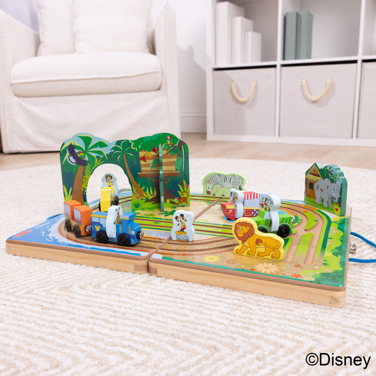 A playroom scene with The Melissa & Doug Disney Take-Along Safari Adventure Wooden Play Set with Built-In Tracks – 20 Pieces | Mickey Mouse, Minnie, Wooden Toy for Boys and for Girls 3+