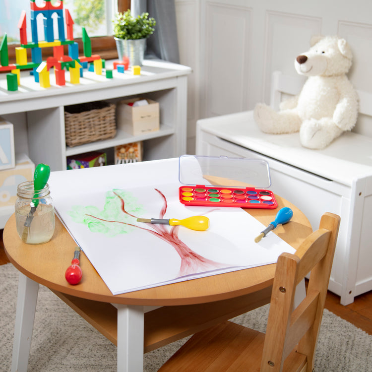 A playroom scene with The Melissa & Doug Art Essentials Easel Pad (17 x 20 inches) With 50 Sheets of White Bond Paper