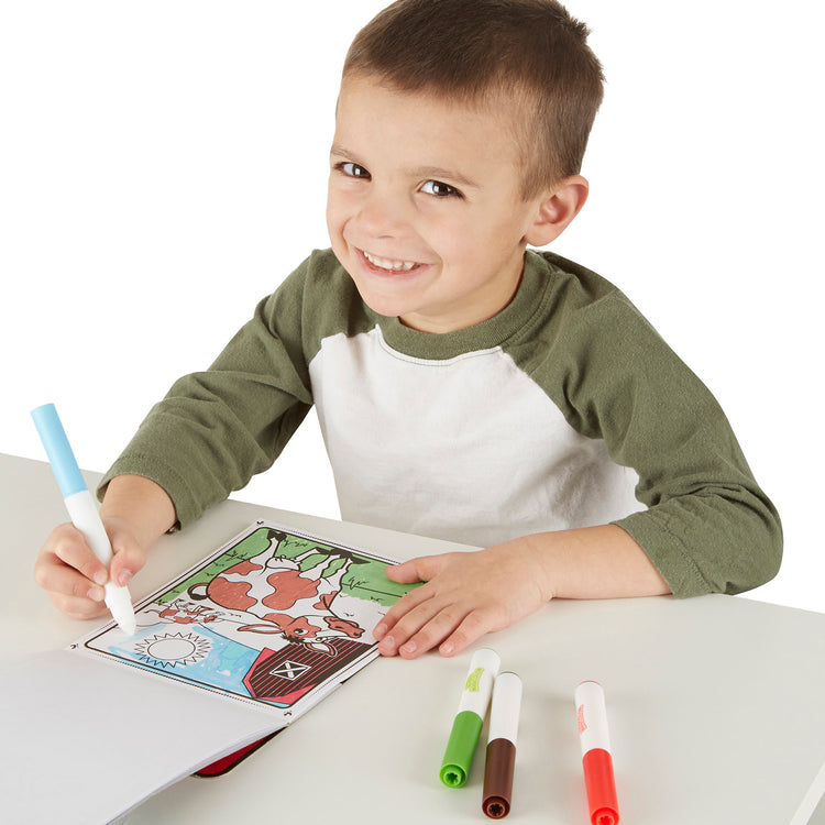 A child on white background with The Melissa & Doug On the Go Magicolor Coloring Pad with 4 Mess-Free Markers, Travel Toy for Boys and Girls Ages 3+  - Farm Animals 