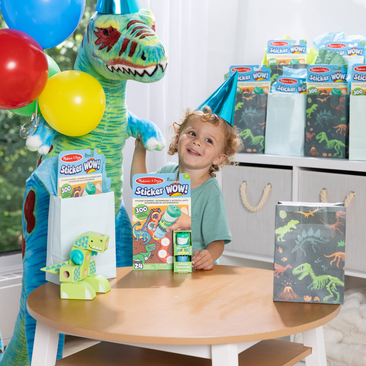 A kid playing with The Melissa & Doug Sticker WOW!™ 24-Page Activity Pad and Sticker Stamper, 300 Stickers, Arts and Crafts Fidget Toy Collectible Character – Dinosaur