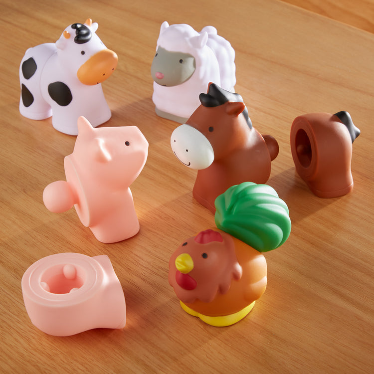 A playroom scene with The Melissa & Doug Pop Blocs Farm Animals Educational Baby Toy - 10 Linkable Pieces