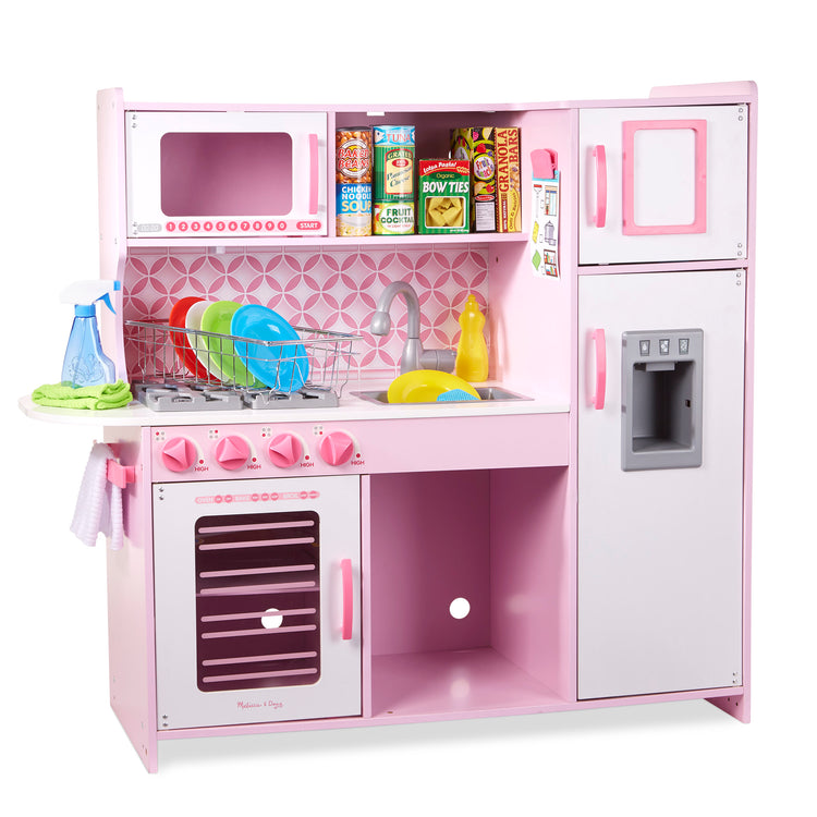 An assembled or decorated The Melissa & Doug Wooden Chef’s Pretend Play Toy Kitchen With “Ice” Cube Dispenser – Cupcake Pink/White