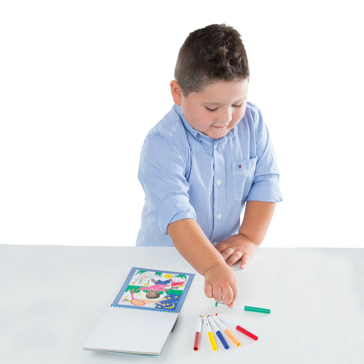 A child on white background with The Melissa & Doug On the Go Color by Numbers Kids' Design Boards: Playtime, Construction, Sports, and More