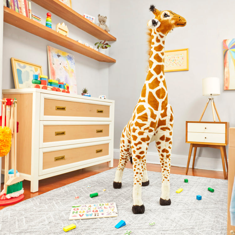 A playroom scene with The Melissa & Doug Giant Giraffe - Lifelike Plush Stuffed Animal (over 4 feet tall)
