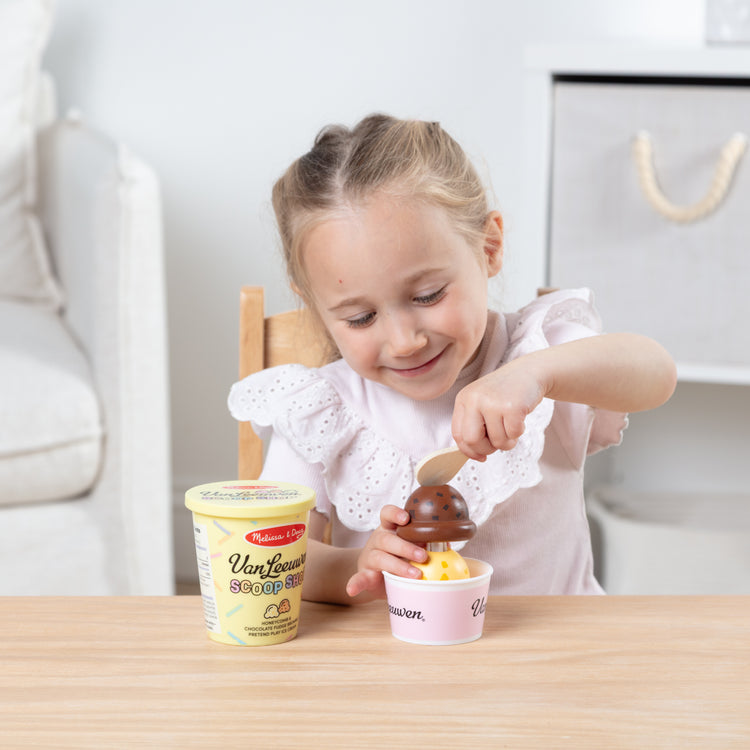 A kid playing with The Van Leeuwen Scoop Shop Ice Cream Play St