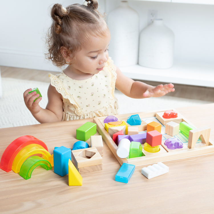 A kid playing with The Sensory Matching Blocks