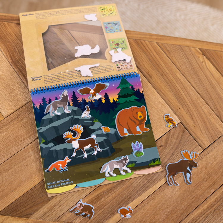 A playroom scene with The Melissa & Doug National Parks Reusable Stickers Jumbo Pad: Park Animals - 5 Scenes, 121 Puffy and Cling Stickers