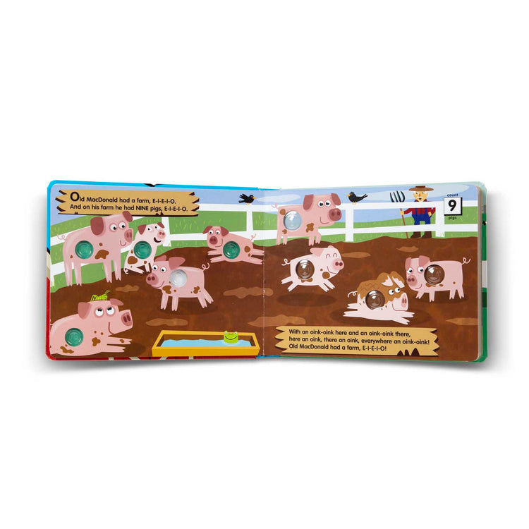 The loose pieces of The Melissa & Doug Children's Book - Poke-a-Dot: Old MacDonald’s Farm (Board Book with Buttons to Pop)