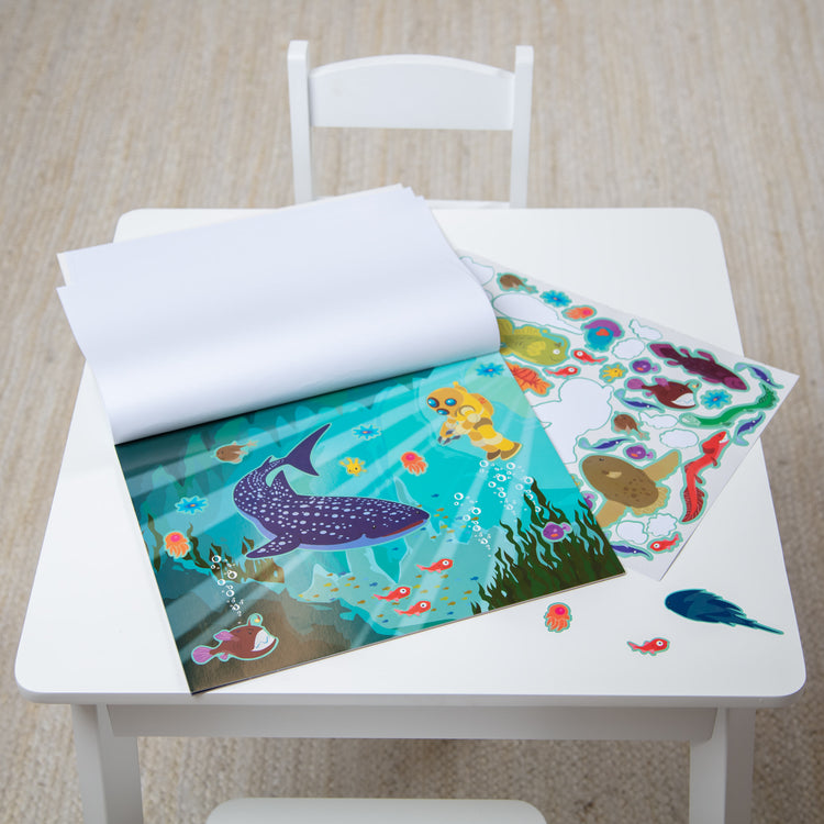 A playroom scene with The Melissa & Doug Reusable Sticker Activity Pad - Under The Sea