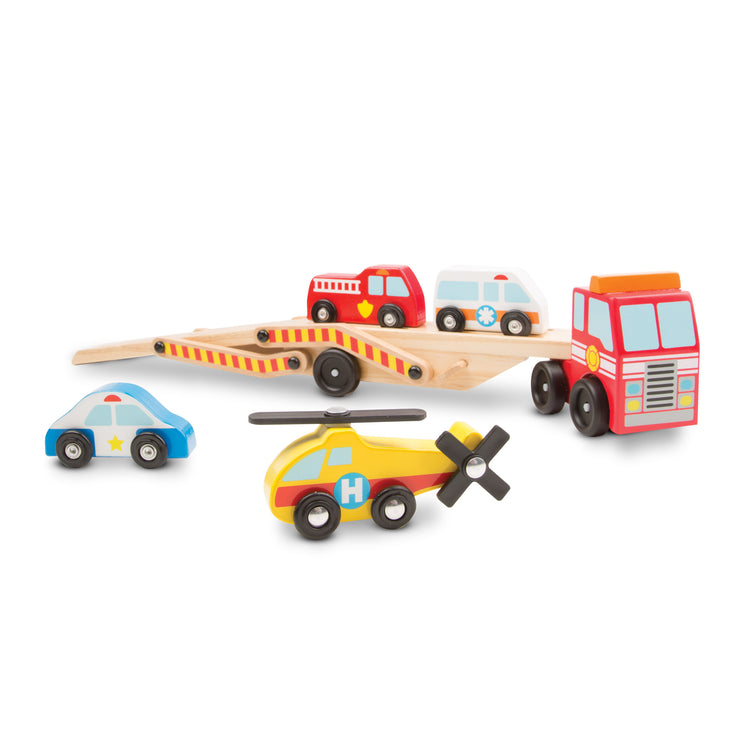The loose pieces of The Melissa & Doug Wooden Emergency Vehicle Carrier Truck With 1 Truck and 4 Rescue Vehicles