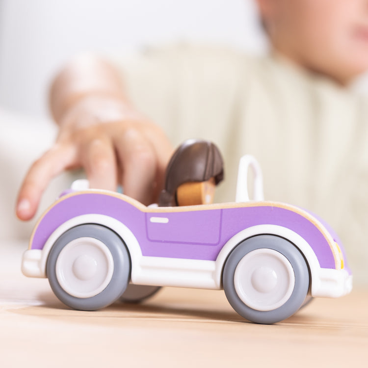 The front of the box for The Melissa & Doug Cheery Lane Vehicle and Girl Figure, Wooden Toy Convertible Car Playset - For Ages 2+