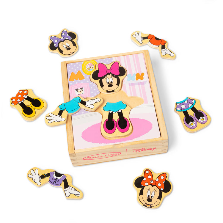 The loose pieces of The Melissa & Doug Disney Minnie Mouse Mix and Match Dress-Up Wooden Play Set Puzzle (18 pcs)