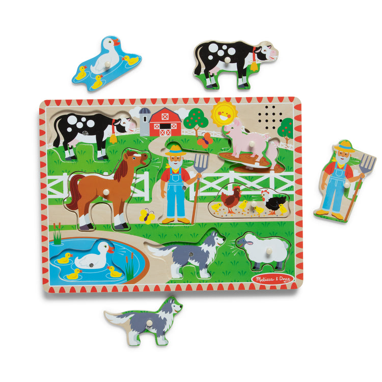The loose pieces of The Melissa & Doug Old MacDonald's Farm Sound Puzzle