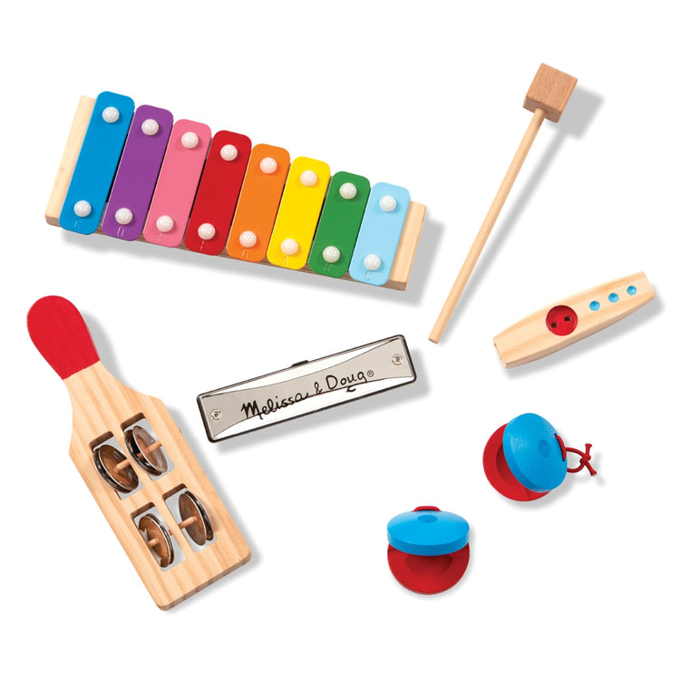 The loose pieces of the Melissa & Doug Band-in-a-Box Hum! Jangle! Shake! - 7-Piece Musical Instrument Set