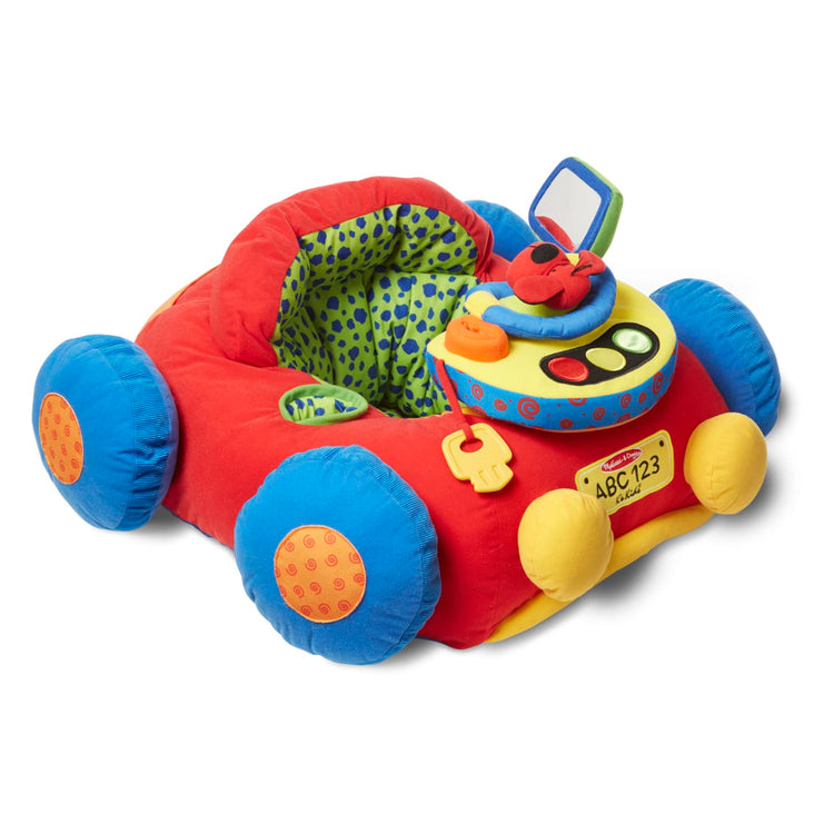 The loose pieces of the Melissa & Doug Beep-Beep and Play Activity Center Baby Toy