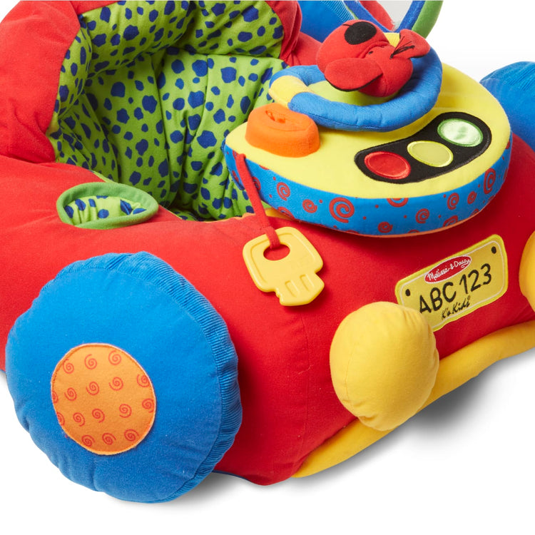 The loose pieces of the Melissa & Doug Beep-Beep and Play Activity Center Baby Toy