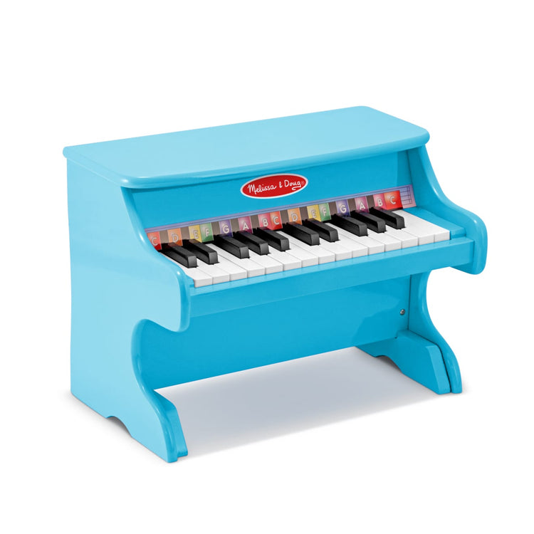 The loose pieces of the Melissa & Doug Learn-to-Play Piano With 25 Keys and Color-Coded Songbook - Blue