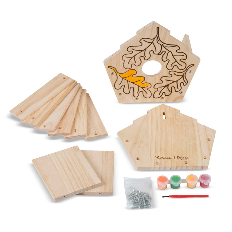 The loose pieces of the Melissa & Doug Created by Me! Birdhouse Build-Your-Own Wooden Craft Kit