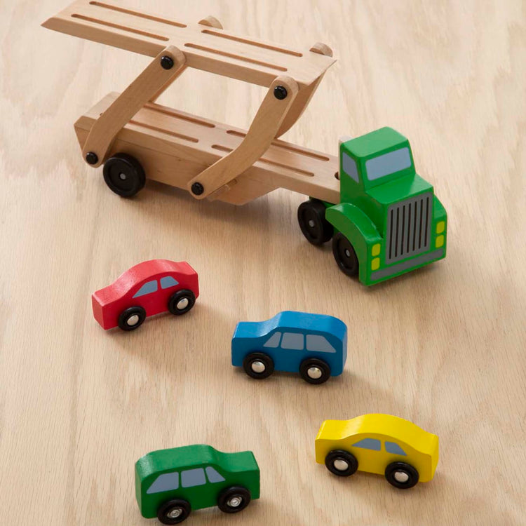 the Melissa & Doug Car Carrier Truck and Cars Wooden Toy Set With 1 Truck and 4 Cars