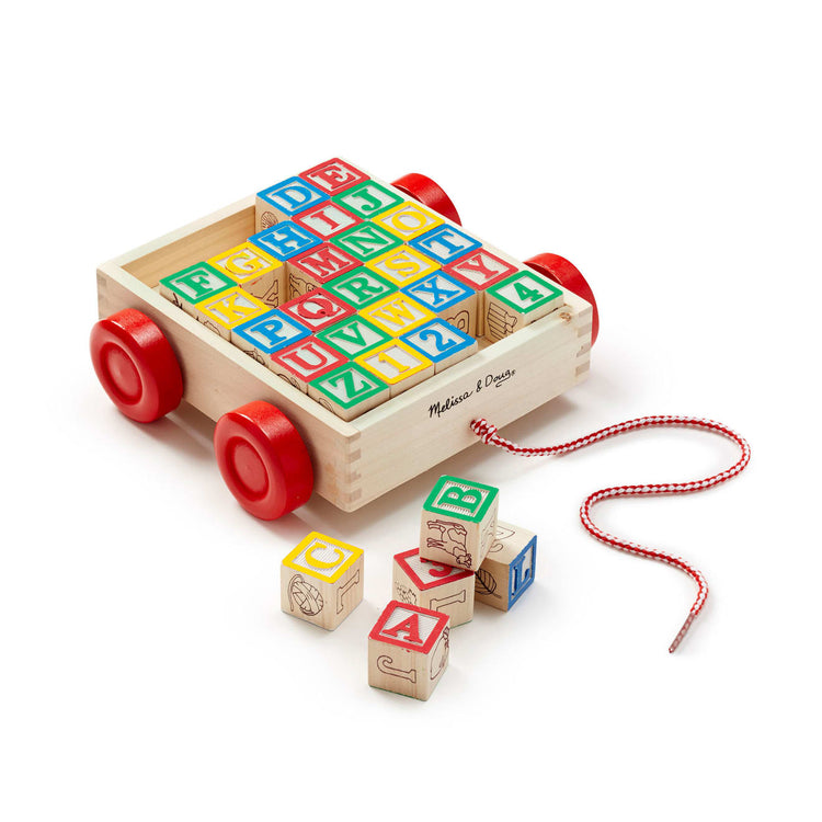 The loose pieces of the Melissa & Doug Classic ABC Wooden Block Cart Educational Toy With 30 1-Inch Solid Wood Blocks