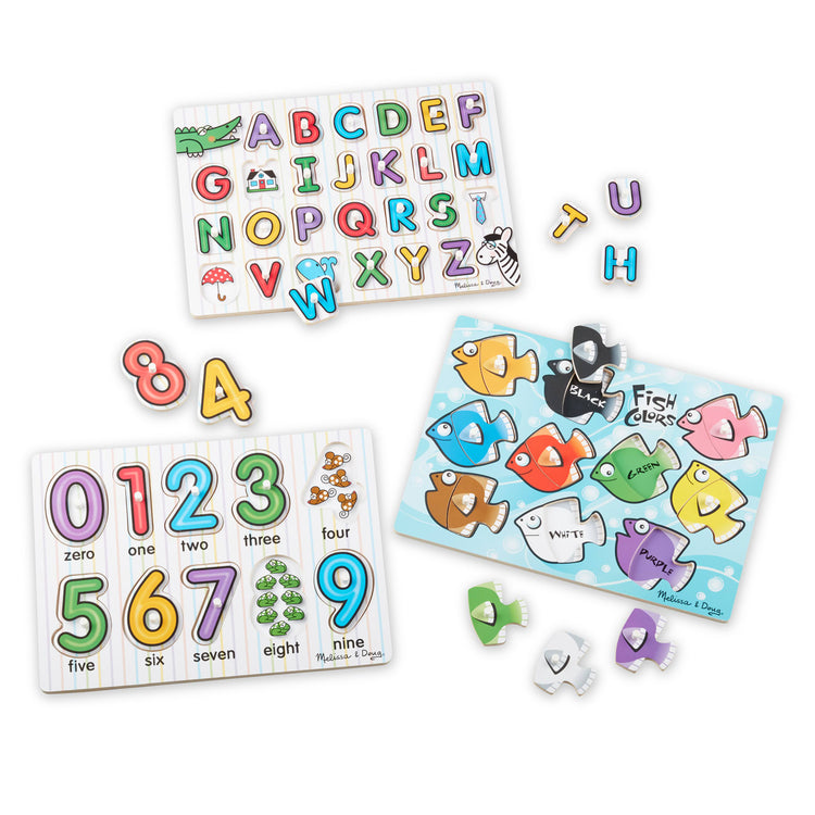 The loose pieces of the Melissa & Doug Classic Wooden Peg Puzzles (Set of 3) - Numbers, Alphabet, and Colors