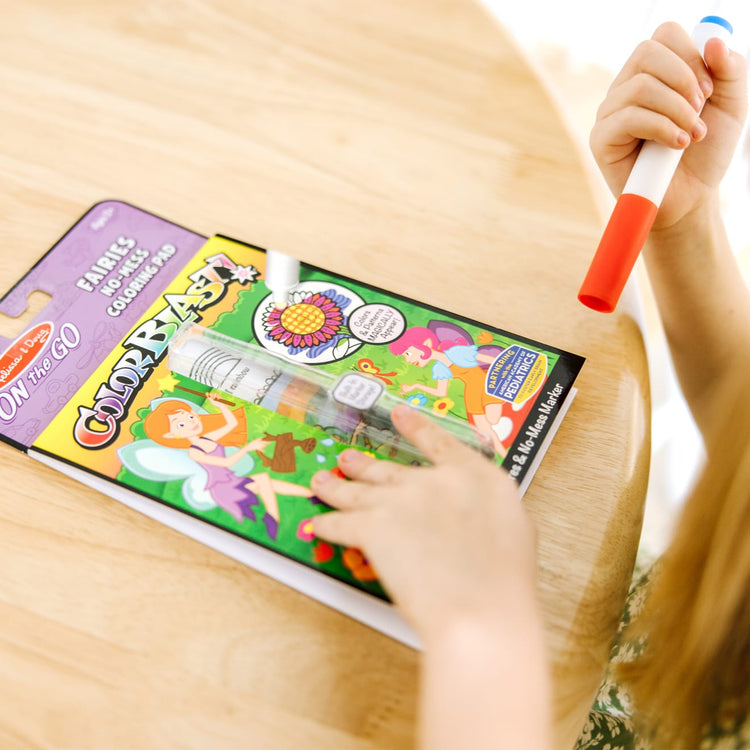The front of the box for the Melissa & Doug On the Go ColorBlast! Activity Book: Fairy - 24 Pictures and No-Mess Pen