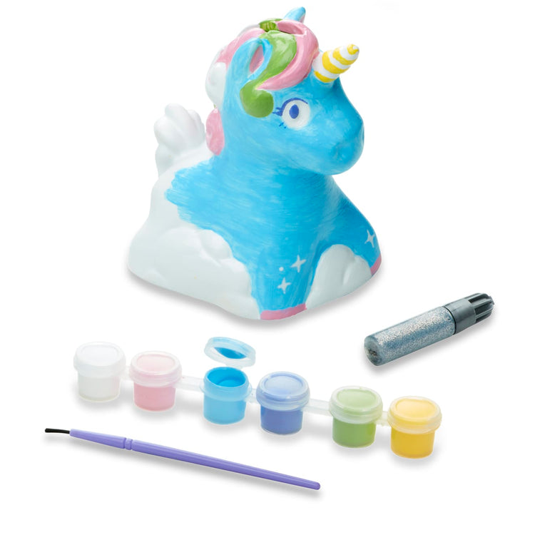 The loose pieces of the Melissa & Doug Created by Me! Decorate-Your-Own Unicorn Bank Craft Kit With 6 Pots of Paint, Glitter Glue, Paintbrush