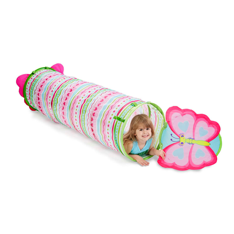 A child on white background with the Melissa & Doug Sunny Patch Cutie Pie Butterfly Crawl-Through Tunnel (almost 5 feet long)
