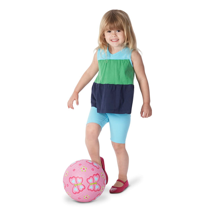A child on white background with the Melissa & Doug Sunny Patch Cutie Pie Butterfly Classic Rubber Kickball