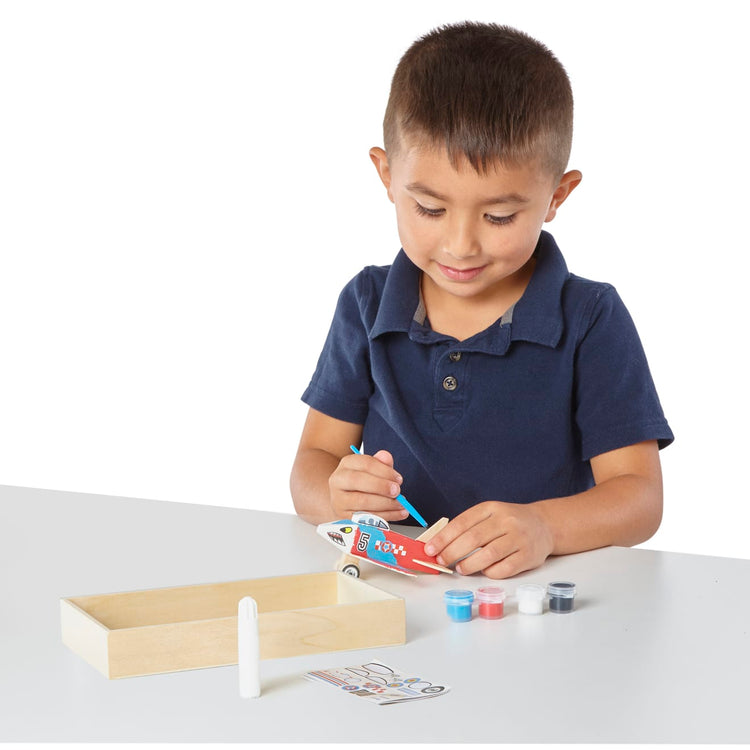 The front of the box for the Melissa & Doug Decorate-Your-Own Wooden Plane Craft Kit