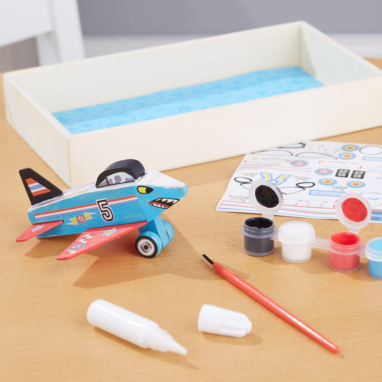 The front of the box for the Melissa & Doug Decorate-Your-Own Wooden Plane Craft Kit