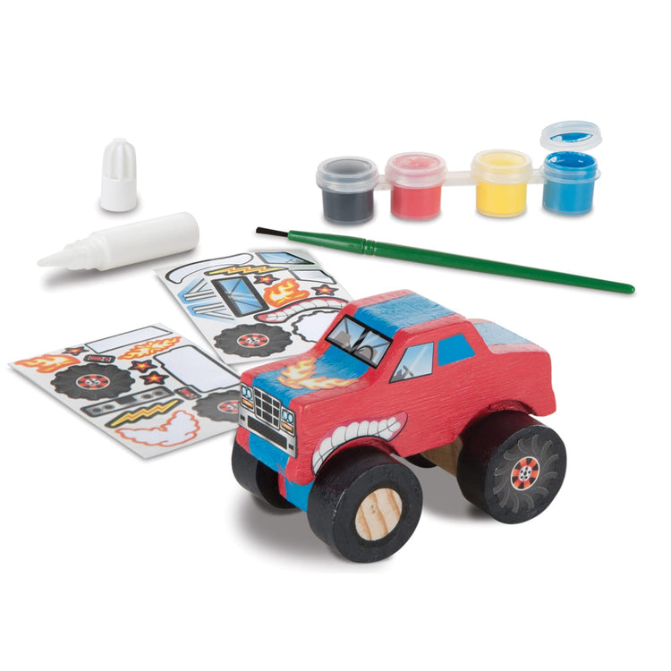 The loose pieces of the Melissa & Doug Created by Me! Monster Truck Wooden Craft Kit