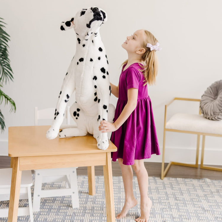 The front of the box for the Melissa & Doug Giant Dalmatian - Lifelike Stuffed Animal Dog (over 2 feet tall)