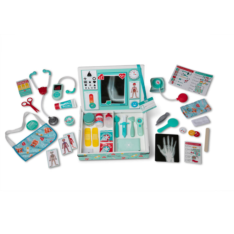 The loose pieces of the Melissa & Doug Deluxe Doctor’s Office Play Set with Take-Along Wooden Case and Magnetic Play Board – 46 Pieces