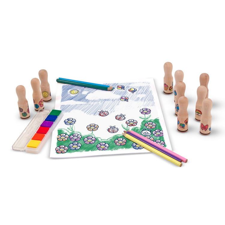 The loose pieces of the Melissa & Doug Deluxe Happy Handle Stamp Set With 10 Stamps, 5 Colored Pencils, and 6-Color Washable Ink Pad