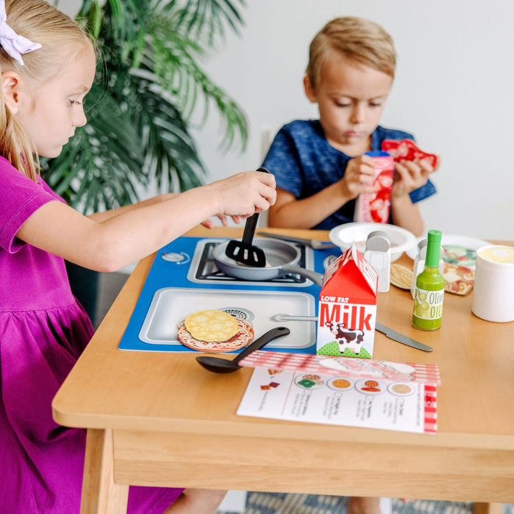 https://www.melissaanddoug.com/cdn/shop/products/Deluxe-Kitchen-Collection-Cooking-Play-Food-Set-031660-1-Kid-Lifestyle.jpg?v=1664894407&width=750
