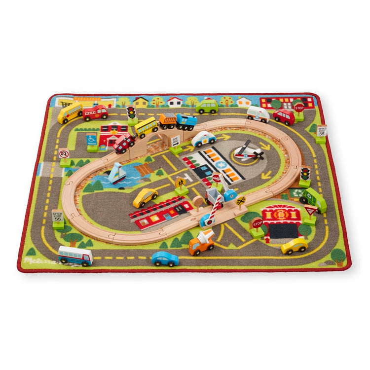 The loose pieces of the Melissa & Doug Deluxe Multi-Vehicle Activity Rug (39.5" x 36.5") - 19 Vehicles, 12 Wooden Signs, Train Tracks