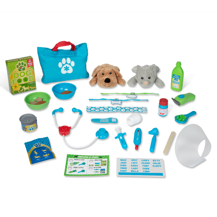 The loose pieces of the Melissa & Doug Deluxe Pet Care Vet, Grooming, Feeding Play Set – 32 Pieces, Plush Stuffed Dog and Cat