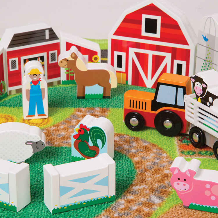 the Melissa & Doug Deluxe Activity Road Rug Play Set with 49 Wooden Vehicles and Play Pieces