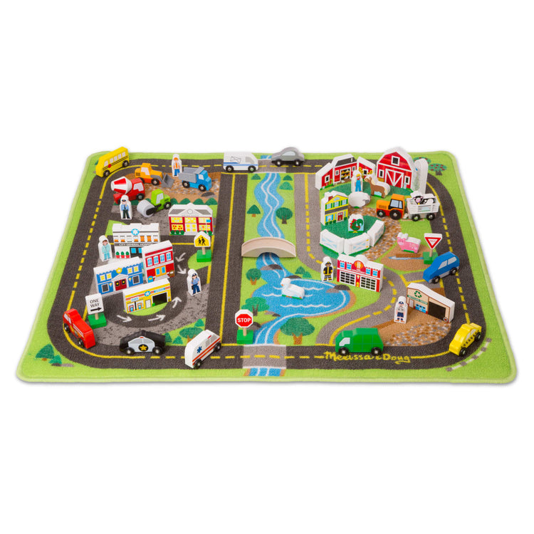 The loose pieces of the Melissa & Doug Deluxe Activity Road Rug Play Set with 49 Wooden Vehicles and Play Pieces