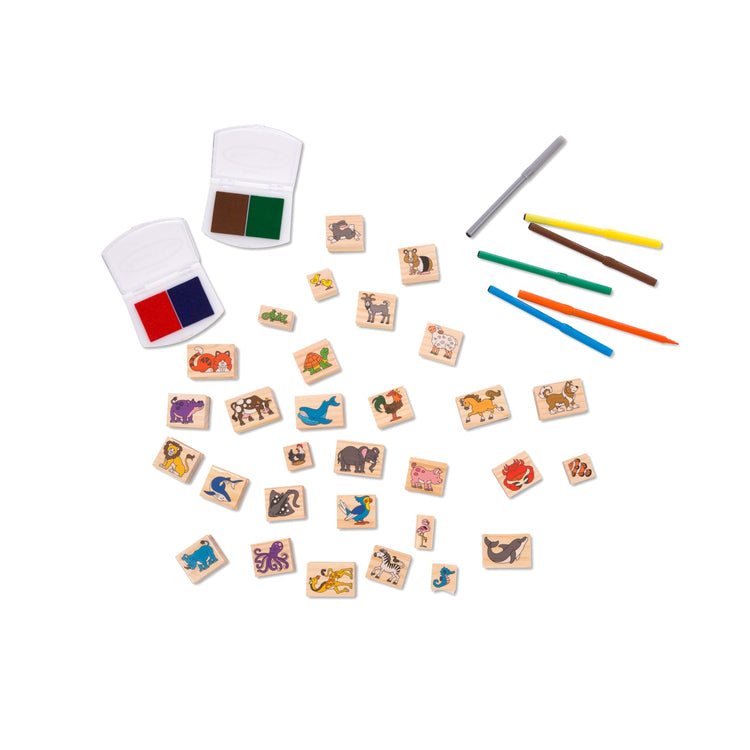 The loose pieces of the Melissa & Doug Deluxe Wooden Stamp Set: Animals - 30 Stamps, 6 Markers, 2 Stamp Pads
