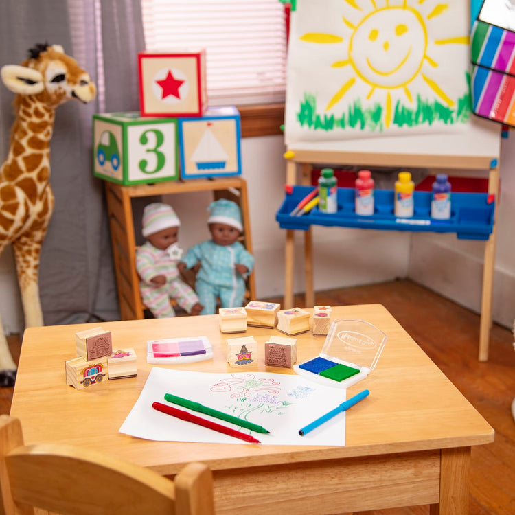 The front of the box for the Melissa & Doug Deluxe Wooden Stamp and Coloring Set – Fairy Tale (30 Stamps, 6 Markers, 2 Durable 2-Color Stamp Pads)